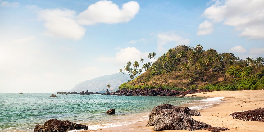 Cola beach offering a perfect coastal sight with the waves crashing at golden shores