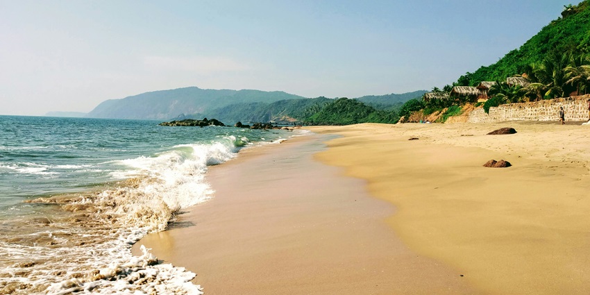 A glimpse of the secluded Cola Beach in South Goa, offering privacy for sunbathers.