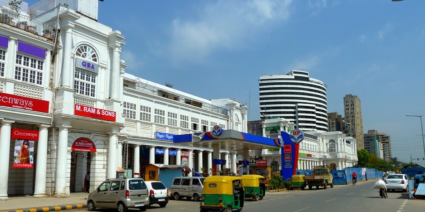 Explore famous restaurants and retail stores at the busy Connaught Place in New Delhi.