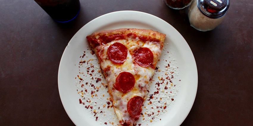 Italian pizzas and pasta with fresh ingredients, perfect for casual gatherings