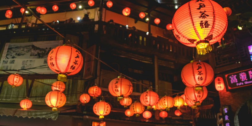 A glimpse of the night market bustling with people and local vendors selling goods.