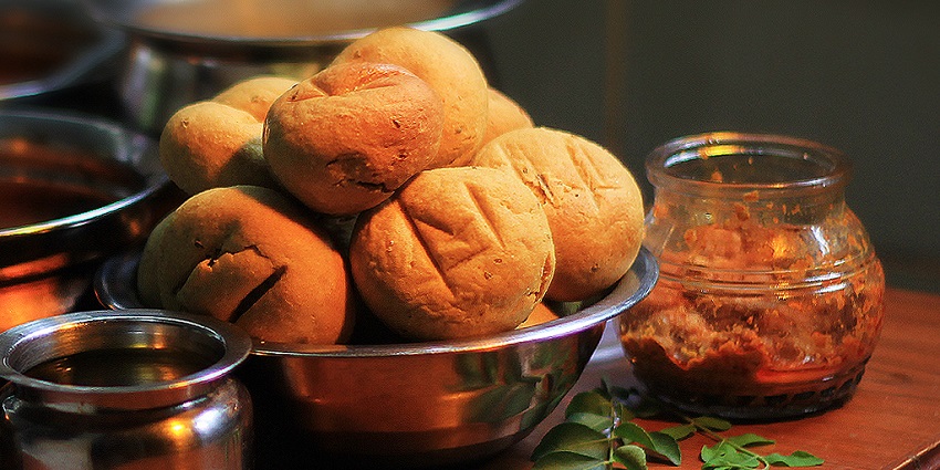 Daal Baati Choorma, the famous food in Jaisalmer baked wheat balls, and lentil curry.