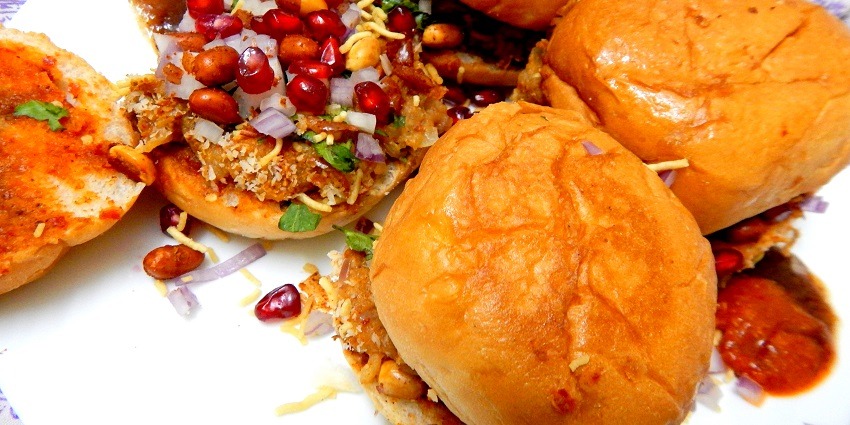 Dabeli, one of the most delicious street food in Vadodara, garnished with peanuts.