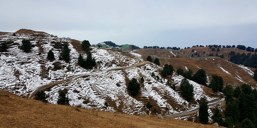 Enjoy the breathtaking views of Dainkund Peak while paragliding in Khajjiar, Chamba