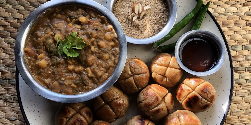 Dal Baati Churma is the famous dish in Kota served with ghee-soaked baati and dal.