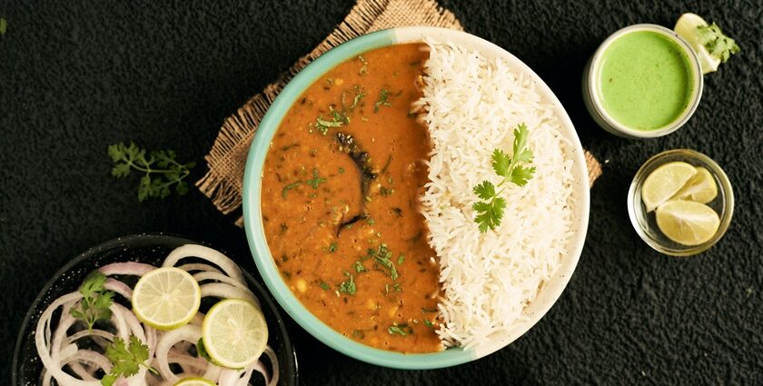 A bowl of dal makhani served with rice, one of the nest street food in Karol bagh