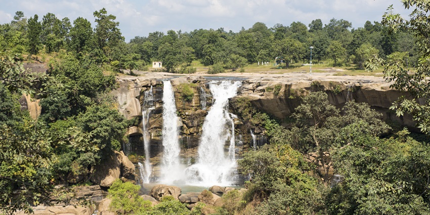 Stunning cascades of the Damau Dhara waterfall, one of the beautiful tourist attractions near Chandrahasini Temple.