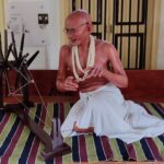 A breathtaking view of the statue of Mahatma Gandhi at dandi beach museum with a charkha.