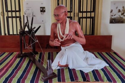 A breathtaking view of the statue of Mahatma Gandhi at dandi beach museum with a charkha.