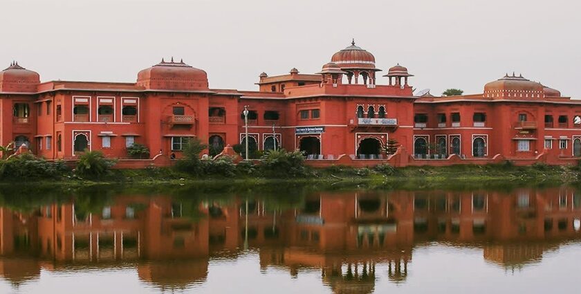 A side view of the Darbhanga Museum showcasing a pathway with plants on the side