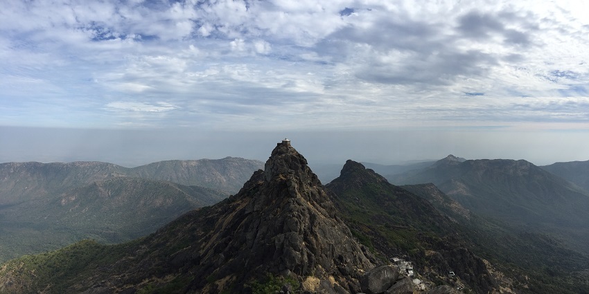 A mindblowing view of a lush green mountain range near Junagadh during the daytime.