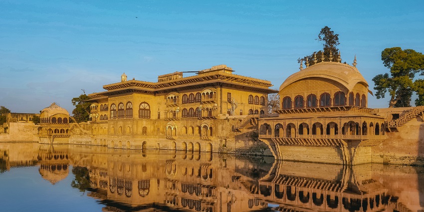 A breathtaking view of the Deeg Palace viewed from the picturesque lake surrounding it.