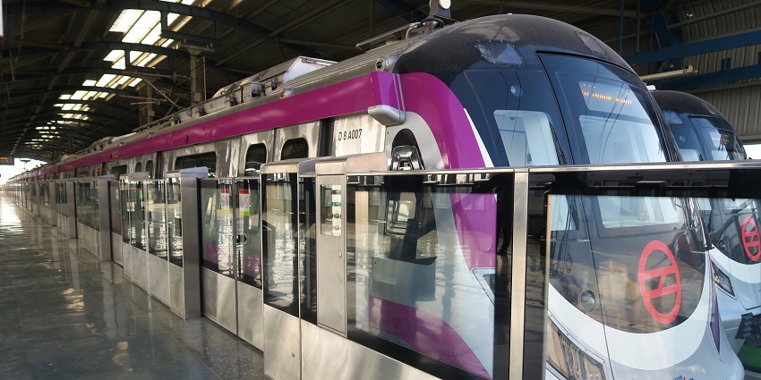 Scenic snapshot of the Magenta line Metro stationed on the platform next to doors