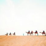 Desert safari Jaisalmer features camel rides, jeep safaris, and Rajasthani traditional dance shows.