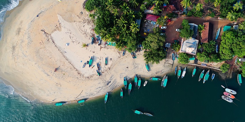 Devbagh Beach, featuring immaculate sands, casuarina trees encircling it, and blue water