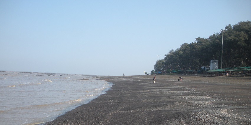 Image of a Devka Beach under clear blue sky, sand and sea waves