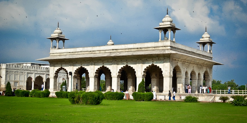 View of Dewas Fort, with architecture in the foreground and natural surroundings in the backdrop.