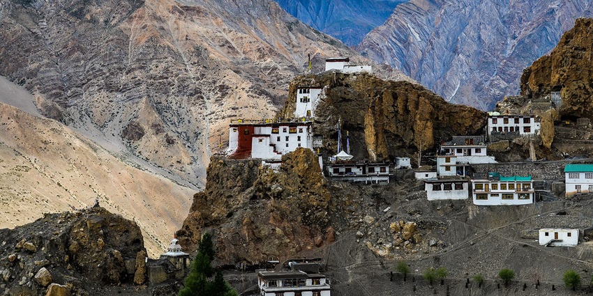Dhankar Gompa perched on cliffs with the village below in Spiti Valley. A notable place to explore is Spiti Valley in May