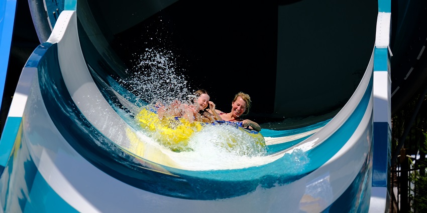 Blue water slide offering a thrilling ride and relaxation for you and your family