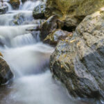 A picture of a waterfall in Andhra Pradesh slowly cascading down a hill