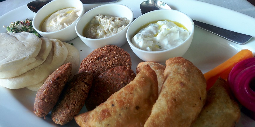 Delicious curd with the sweets made of flour and the sugar which is crispy and tasty