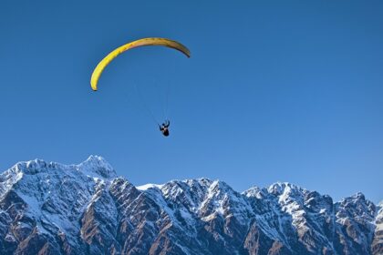 Experience Dobhi paragliding soaring over the lush green meadows of Himachal Pradesh.