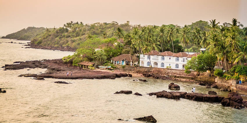 Panoramic view of a cottage which is surrounded by lush green trees near the Panjim in Goa
