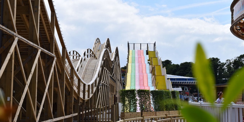 A picture of a roller coaster track at a theme park in Delhi taken from a parallel angle during daytime