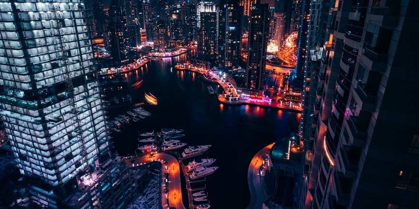 Dubai Marina with a vibrant city skyline, one of the top spots for indoor skydiving Dubai.