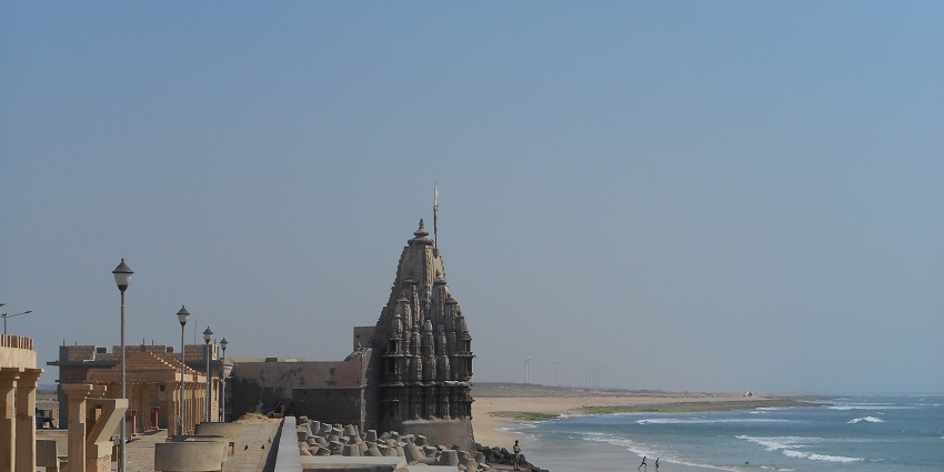 A scenic view of Dwarka temple, located on the shores of Dwarka beach, one of the best beaches in Gujarat.