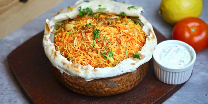 A glimpse of chicken biryani in a handi, one of the popular street foods in Dwarka.