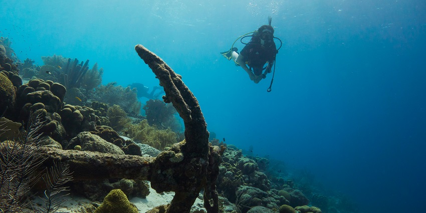 Underwater rock formations and swim-throughs while Similan Islands scuba diving.