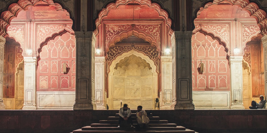 The panoramic view of a mosque with stone stairs, surrounded by a peaceful environment.