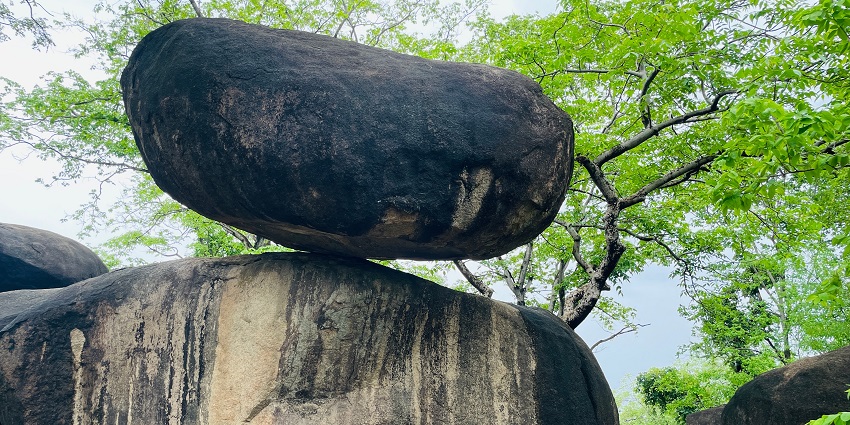 The Balancing Rock, a geological wonder, balancing perfectly on a smaller rock