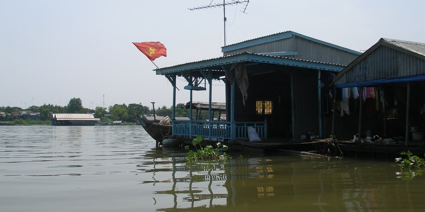 Serene Bassac River in the Mekong Delta, known for its floating markets and rural charm