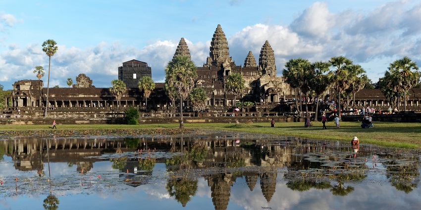Visit the beautiful Angkor Wat temple complex with its iconic spires against the sky, one of the top things to do in Siem Reap