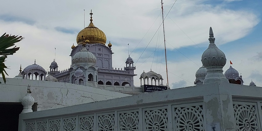 Gurudwara Amb Sahib is a peaceful and sacred site with traditional Sikh architecture.