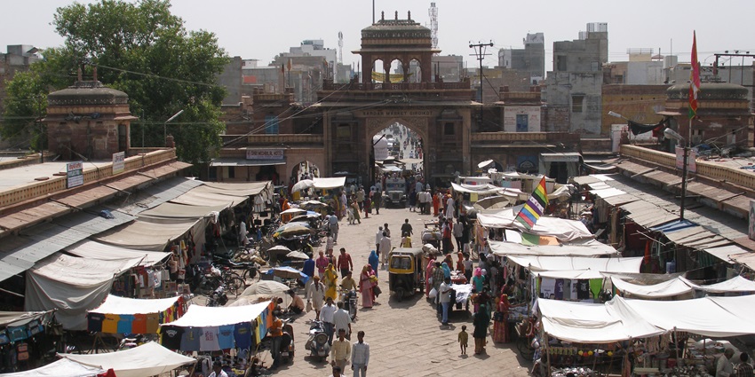 An aerial view of a street market in Alwar with locals shopping all around