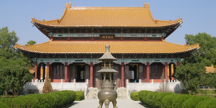 A frontal view of a monastery in Lumbini, Nepal built in traditional architecture