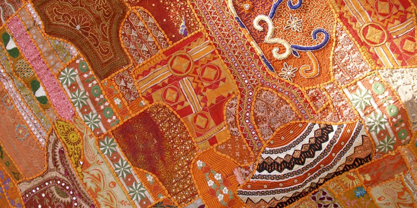 An image of colorful fabric artwork, ornamental patterns on textile, similar to Panipat