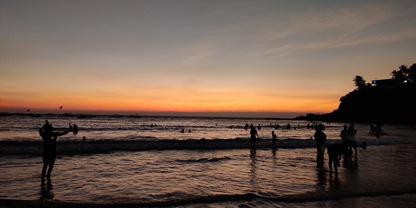 Watching the setting sun over the Baga Beach, one of the best things to do in Goa at night