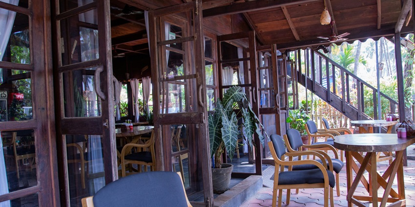 A mesmerising inside view of a cafe in Goa with stunning architecture during the day.