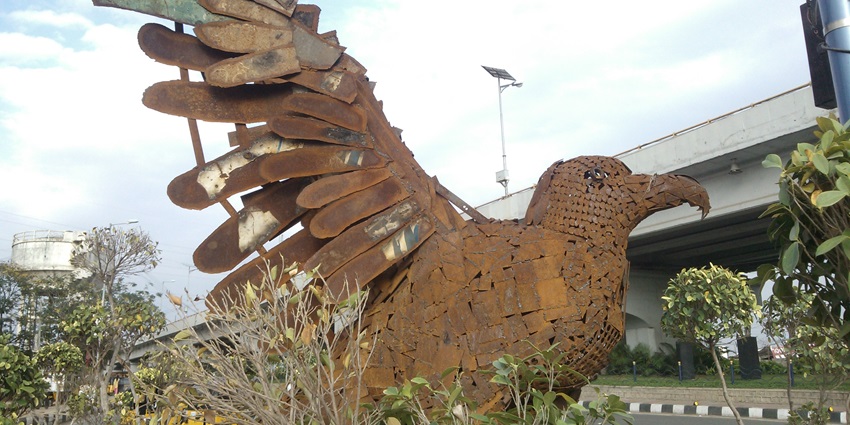 A creative park featuring sculptures made from recycled metal scraps.