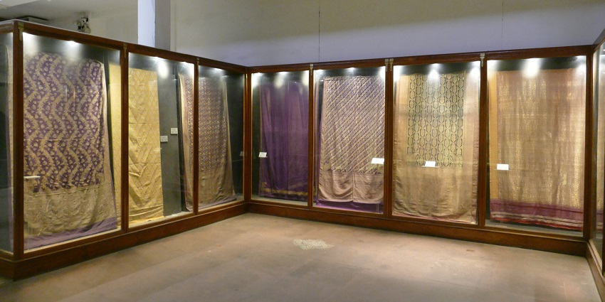 You can spot different textures, prints and types of fabrics and textiles, including embroidered fabrics and bandhani.