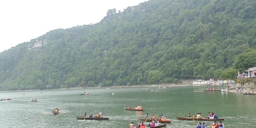 Several people on kayaks, waiting for their turn for an exciting adventure on calm waters.