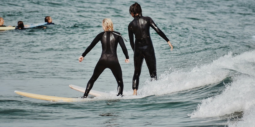 An image of two people in the middle of the ocean performing water sports in Krabi.