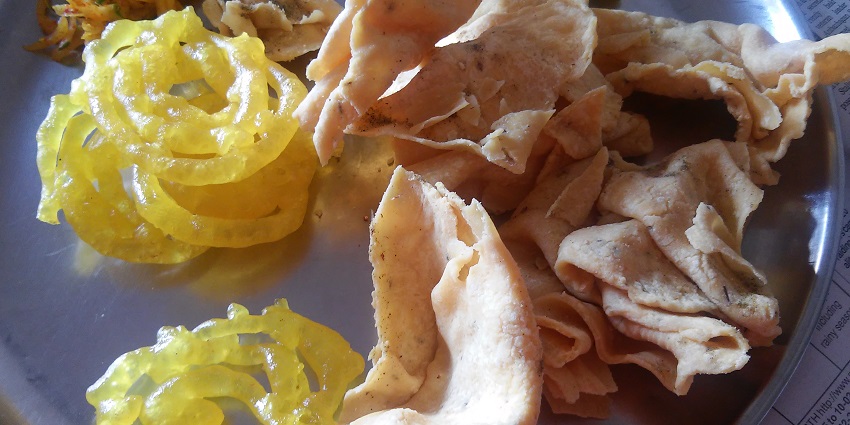 Fafda served with sweet Jalebi, one of the best street food in Ahmedabad.