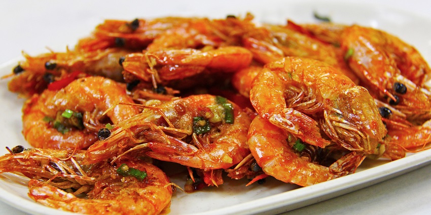 Try some delicious tempura fried prawns at the Farzi Cafe in Connaught Place
