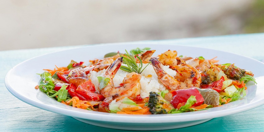 A glimpse of succulent seafood topped with veggies served at the Bhaskara Restaurant.