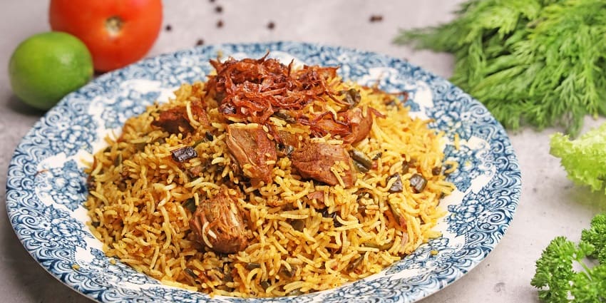A glimpse of scrumptious biryani served in a handi, one of the best foods in Kakinada.